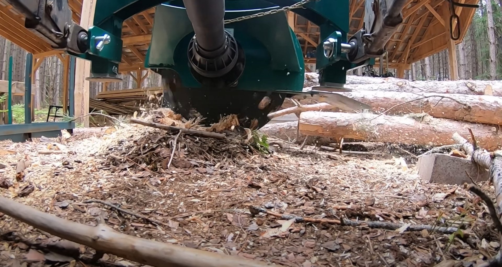 Portable sawmill processing freshly cut timber Portable sawmill processing freshly cut timber